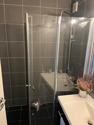 a shower with a glass door in a bathroom at Trondheim in Trondheim