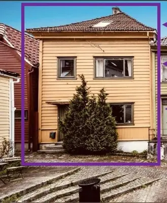 a house with a purple frame in front of it at Live the history in Bergens heart - Stay unique in Bergen