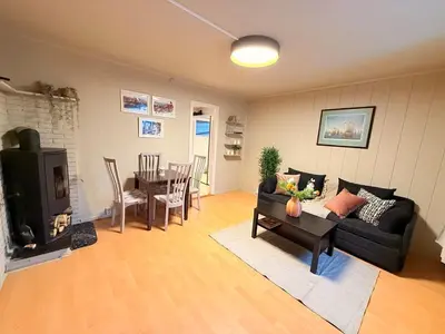 a living room with a couch and a table at Live the history in Bergens heart - Stay unique in Bergen