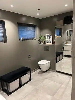a bathroom with a toilet and a window at Enebolig til utleie in Trondheim