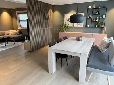 a dining room with a white table and chairs at Enebolig til utleie in Trondheim