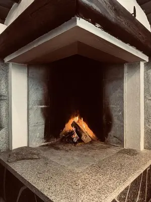 a brick oven with a fire inside of it at Large, cozy, and spacious cabin in Geilo in Geilo