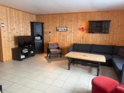 a living room with a couch and a table at Family-Friendly Apartment In Central Beitostølen in Beitostøl