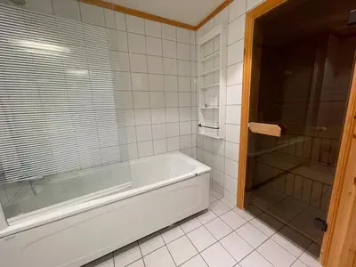 a bathroom with a tub and a glass shower at Family-Friendly Stay Near Ski Trails! in Beitostøl