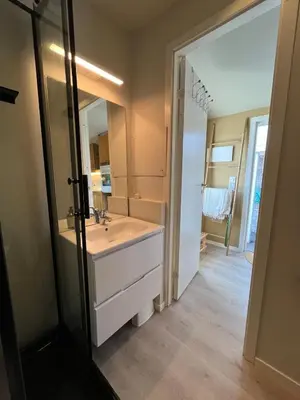 a bathroom with a sink and a mirror at Cozy studio near Bergen in Bergen