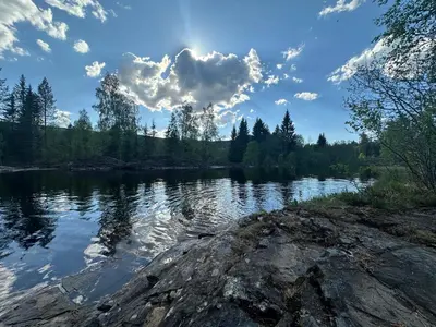 a view of a lake with a cloudy sky at Turifoss Camping Tent pitch in Svedjan