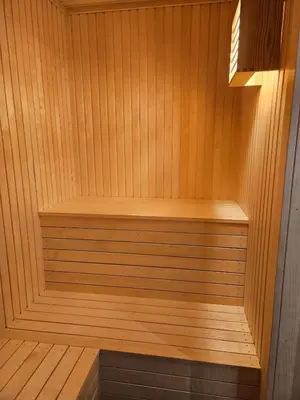 a wooden sauna with a wooden bench in it at Utsikten in Sør-Fron