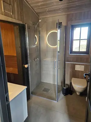 a bathroom with a shower and a toilet at Utsikten in Sør-Fron
