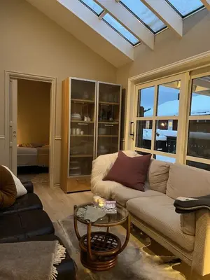 a living room with a couch and a table at Large single-family home on Dalgård with walking distance to VM2025 in Trondheim