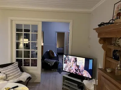 a living room with a flat screen tv and a couch at Large single-family home on Dalgård with walking distance to VM2025 in Trondheim