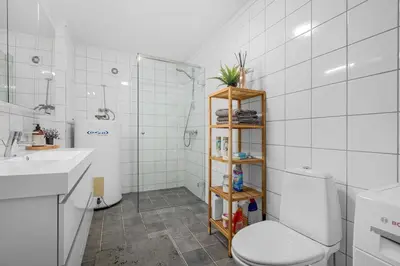 a bathroom with a toilet and a sink and a shower at Apartment in Lillehammer in Lillehammer