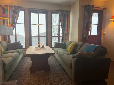 a living room with a couch and a coffee table at Family-Friendly Stay With Stunning Mountain Views! in Beitostøl