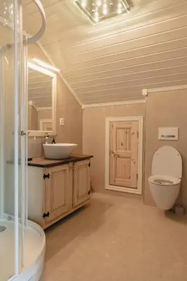 a bathroom with a sink and a toilet at Solheimen konferansehotell AS in Hedalen