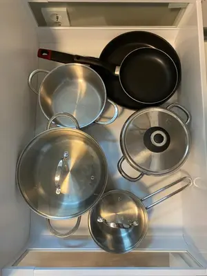 a group of pots and pans in a refrigerator at Trollstova in Sogndal