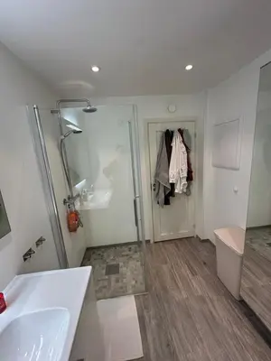 a bathroom with a shower and a sink and a toilet at Leilighet på Byåsen, i nærheten av Granåsen in Trondheim