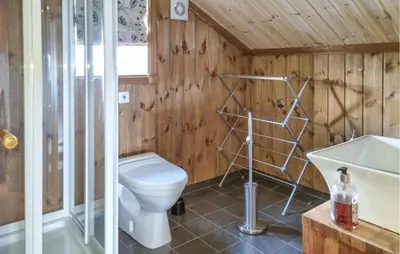 a bathroom with a toilet and a sink at Gorgeous Home In Vang I Valdres in Vang I Valdres