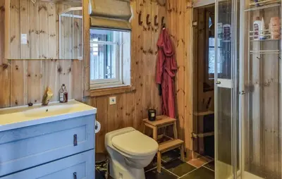 a bathroom with a toilet and a sink and a shower at Gorgeous Home In Vang I Valdres in Vang I Valdres