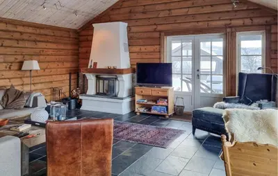 a living room with a couch and a fireplace at Gorgeous Home In Vang I Valdres in Vang I Valdres