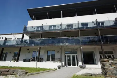 an external view of a building with a balcony at Leilighet på Oppheim, Voss in Vossevangen