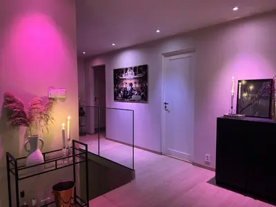 a living room with pink lights on the walls at Modern Home with a View, Easy access to World Ski Championships in Malvik