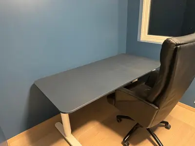 a desk with a chair and a table and a desk at Modern Home with a View, Easy access to World Ski Championships in Malvik
