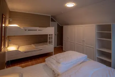 a bedroom with two bunk beds in a room at Bakkebyvegen 15B in Trysil