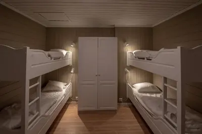 a room with two bunk beds and a door at Bakkebyvegen 15A in Trysil