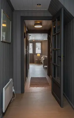 a hallway with a door leading to a living room at Newly renovated cabin in Nesfjellet, Nesbyen in Nesbyen