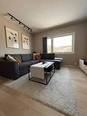 a living room with a couch and a table at Ski VM 2025 in Trondheim