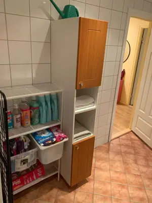 a refrigerator with its door open with its shelves at 2 bedrooms apartment in Trondheim
