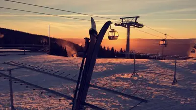 a pair of skis in the snow next to a ski lift at Alpinlandsbyen - Ski in - Ski out -Nr 34 in Hafjell