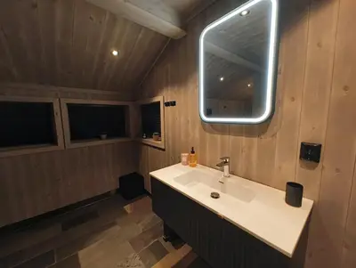 a bathroom with a sink and a mirror at Hytte-13 Cozy cabin close to Kvitfjell in Fåvang