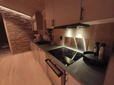 a kitchen with a stove and a counter top at Hytte-13 Cozy cabin close to Kvitfjell in Fåvang