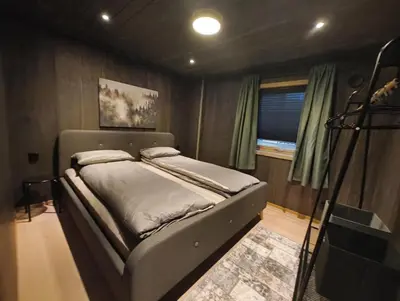 a bedroom with a bed in a room at Hytte-13 Cozy cabin close to Kvitfjell in Fåvang