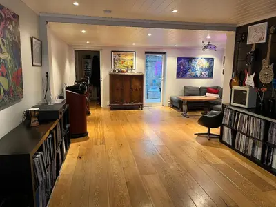 a living room with a couch and a table at Older Villa with large garden in Trondheim