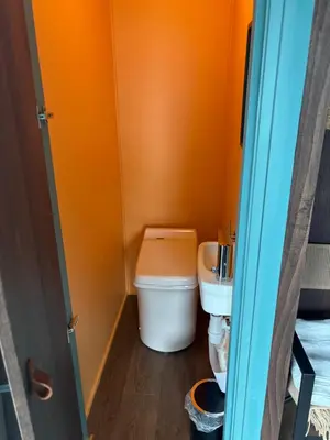 a small bathroom with a toilet and a sink at Atlantic Road Sleeping Experience Re-Treats in Vevang
