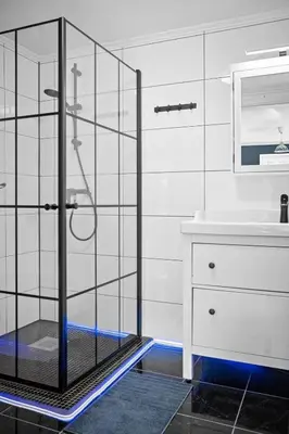 a glass shower in a bathroom with a sink at Fjord View Cabin Near Bergen & Nature in Grottveit