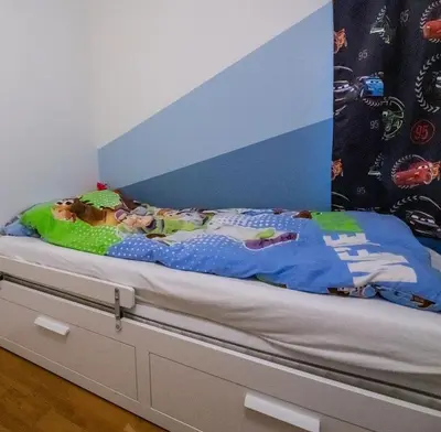 a bedroom with a bed with a blue and white canopy at Spacious house, close to Granåsen Ski Arena! 4 beds, 2 bathrooms, free parking in Trondheim