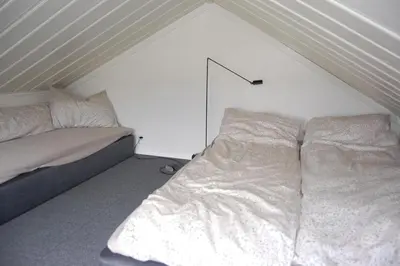 a bedroom with a bed in a attic at Apartment on Golsfjellet! in Gol