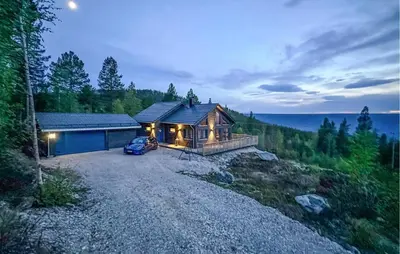 a house with a car parked in front of it at 3 Bedroom Cozy Home In Rendalen in Rendalen