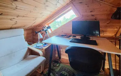 a desk with a computer in a tiny house at Gorgeous Home In Eivindvik With Wifi in Eivindvik