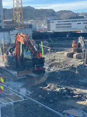 a construction site with a bulldozer on the ground at Dinbnb Home - History meets Modern I 3-Story Bergen House in Bergen