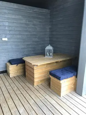 a sauna with two benches on a wooden deck at Amazing home in the heart of Nordfjordeid in Nordfjordeid