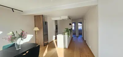 a living room with a couch and a table at Best view in town in Bergen