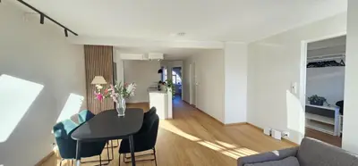 a living room with a table and chairs at Best view in town in Bergen