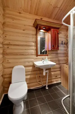 a bathroom with a toilet and a sink at Koselig hytte Gålå Vakre Lauvåsen in Sør-Fron