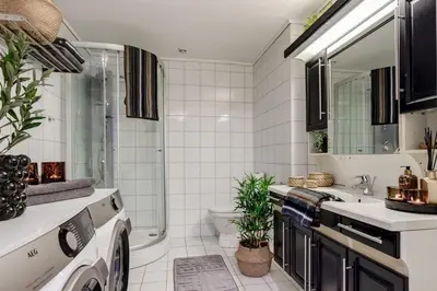 a bathroom with a shower and a sink and a toilet at Trondheim VM-arena in Trondheim