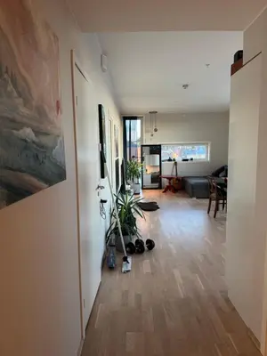 a living room with a painting on the wall at Near Granåsen in Trondheim