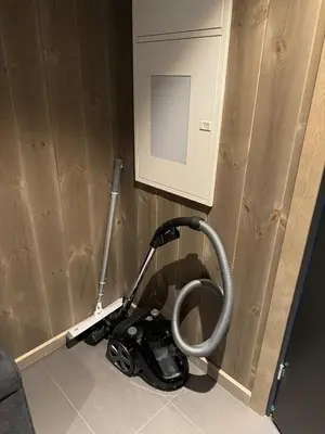 a vacuum in the corner of a room at New! Apartment Fjellandsbyen Hemsedal Ski&bike in Kyrkjebøen