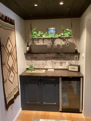 a table with plants on top of a wall at Ustedalen Lodge in Geilo